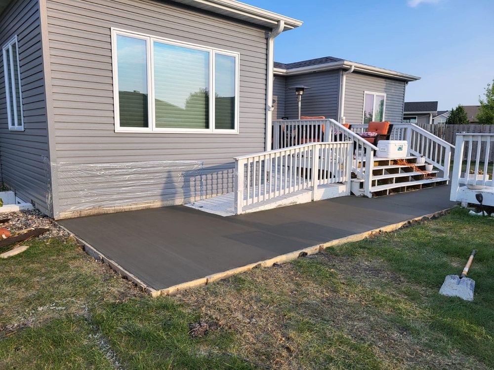Enhance your home's curb appeal with our expert sidewalk installation service, providing durable and aesthetically pleasing pathways that seamlessly blend with your landscape while ensuring safety and longevity for years to come. for Golden Construction in West Fargo, ND