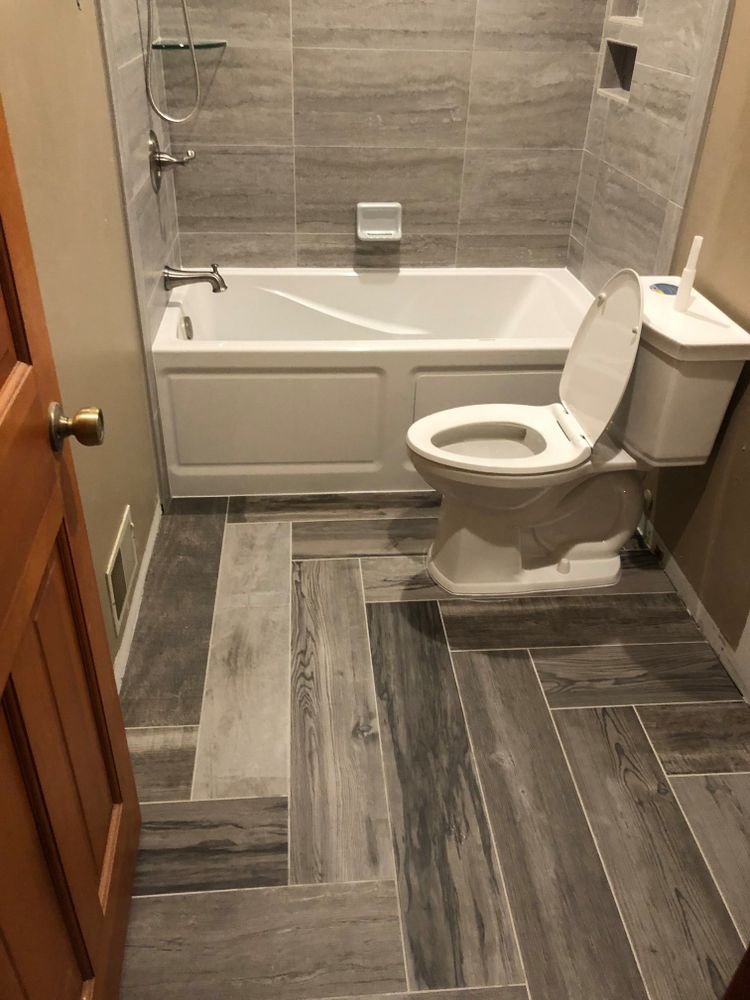 We specialize in transforming your outdated bathroom into a modern and functional space through our expert remodeling services, including installing new fixtures, tiles, lighting, and more. for Watson's Handyman Services in Genesee County, MI