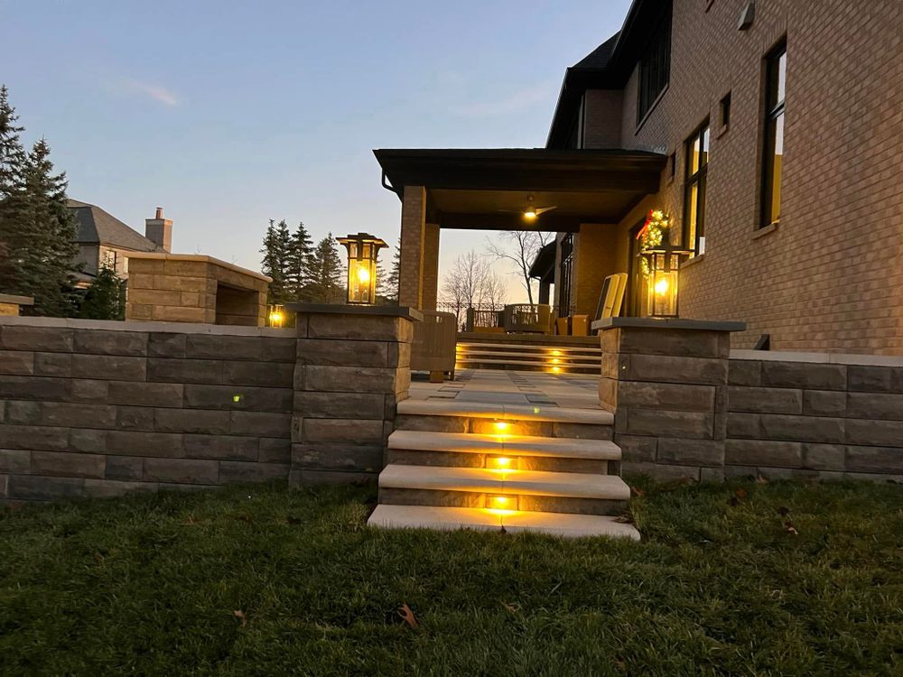Our Retaining Wall Construction service enhances your outdoor space's stability and aesthetics by expertly designing and building durable walls that prevent soil erosion while complementing your home's landscaping. for J A Landscaping in Washington, MI