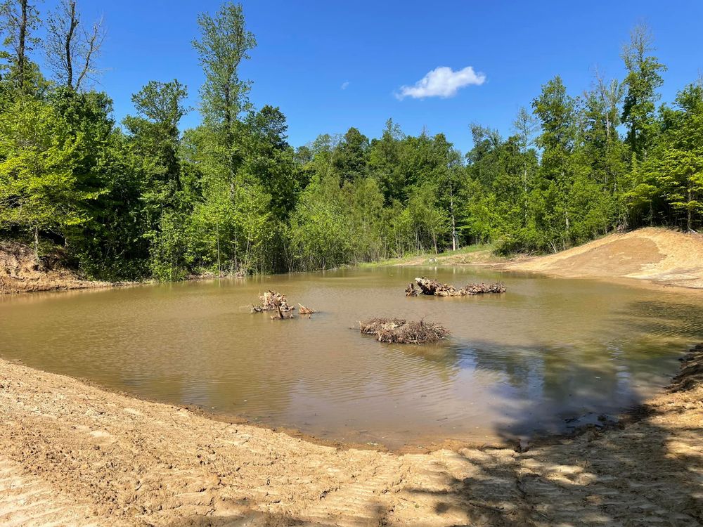 Our Ponds service offers expert excavation and design to create beautiful, functional water features that enhance your property’s aesthetics and value, ensuring a serene landscape tailored to your unique vision. for Beaver Excavating Services in Friendship, TN