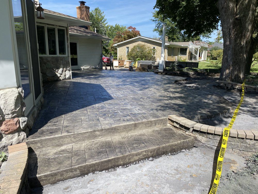 Transform your outdoor space with our expert patio design and installation service. We create durable, stylish concrete patios tailored to enhance the beauty and functionality of your home’s exterior. for JW Concrete Services LLC in Lansing, MI