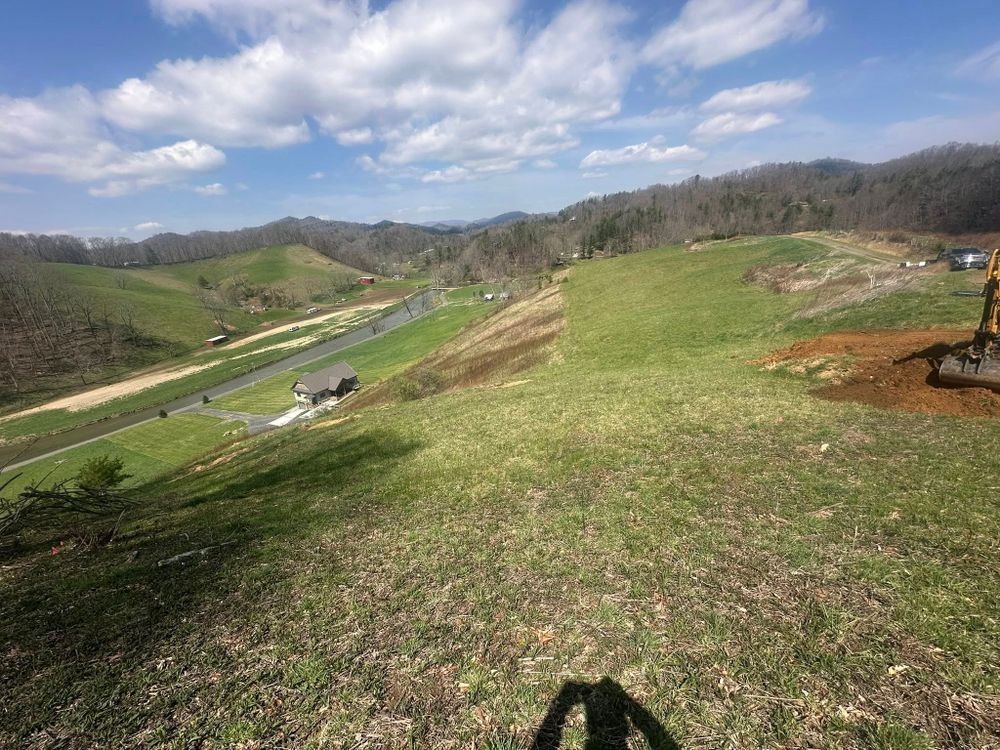 Our lawn care maintenance service ensures a pristine, healthy yard by providing regular mowing, trimming, and fertilizing, tailored to keep your landscape vibrant and well-maintained throughout the year. for Trophy Ridge Grading & Hauling in Mountain City, TN