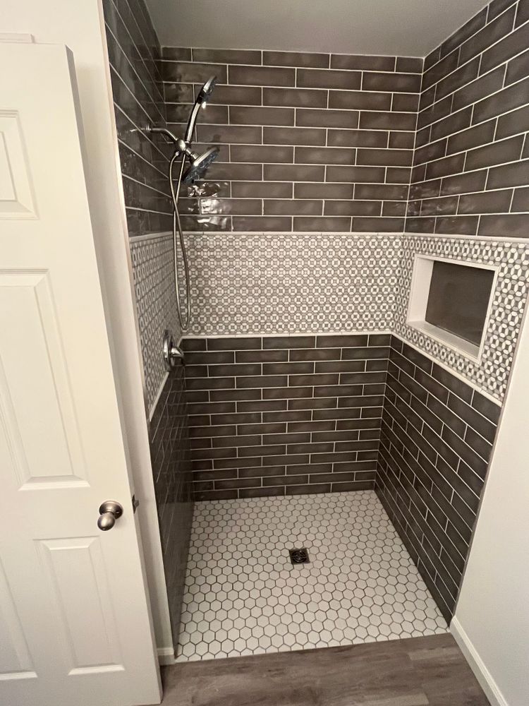 Tile showers and tub surrounds for Chapman Surfaces Tile & Remodeling in Milan, MI