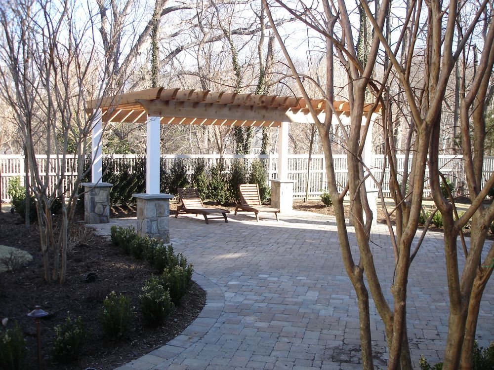 Enhance your outdoor living space with our custom pergolas, providing shade and style. Tailored to fit any garden design, we create a perfect blend of functionality and aesthetic appeal for your home. for M&M Professional Landscaping in Sterling, VA