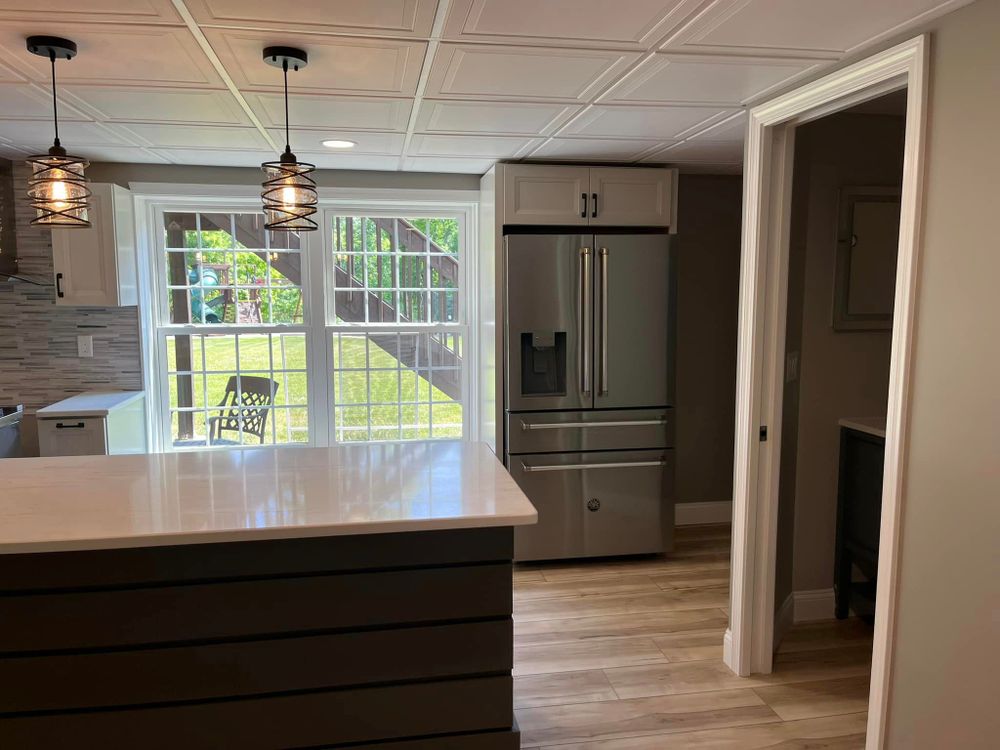 Our Kitchen Renovation service offers homeowners a complete transformation of their kitchen space, providing top-notch construction and remodeling solutions tailored to meet individual needs and preferences. for Laura Mae Properties in Wolcott, CT