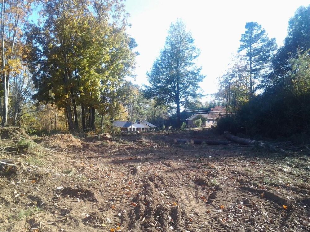 Our Land Clearing service efficiently removes unwanted vegetation, trees, and debris from your property, preparing the land for new projects while enhancing safety and increasing usable space. Trust us for a tidy transformation. for Wofford's Grading Clearing and Landscaping in Milton, GA