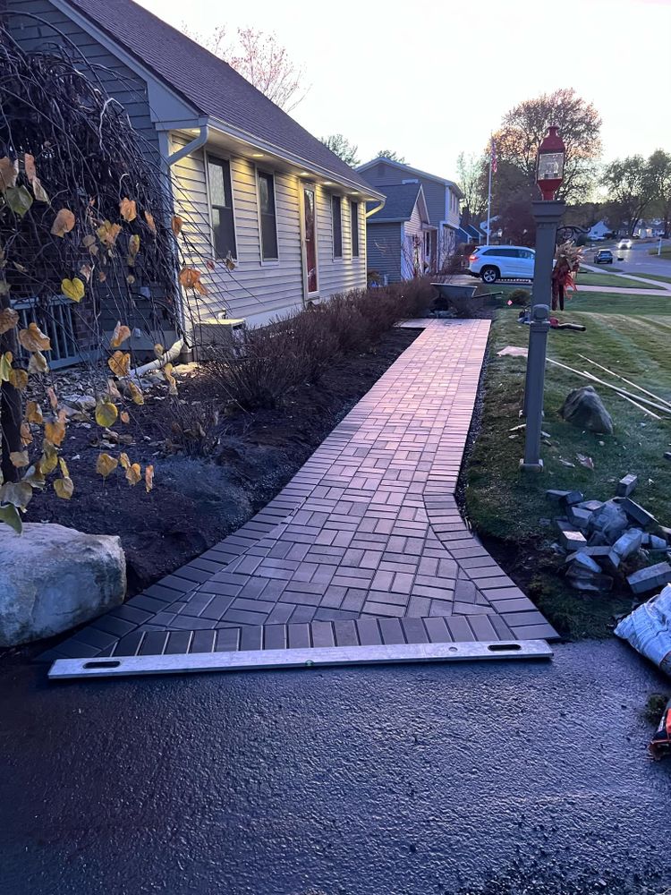 Our Brickwork service expertly combines durability and aesthetics, offering homeowners beautifully crafted walls, patios, and fireplaces that enhance property value while ensuring long-lasting strength and minimal maintenance for peace of mind. for Elite Pavers and Fencing in Springfield, MA