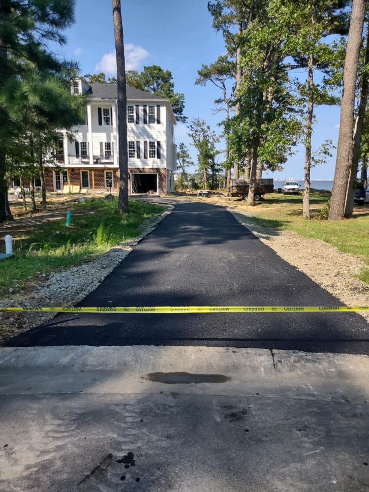 Upgrade your home with a durable and sleek asphalt driveway from our expert team. Enhance curb appeal, increase property value, and enjoy long-lasting quality with our professional asphalt paving service. for O.C. Paving in Dagsboro, DE