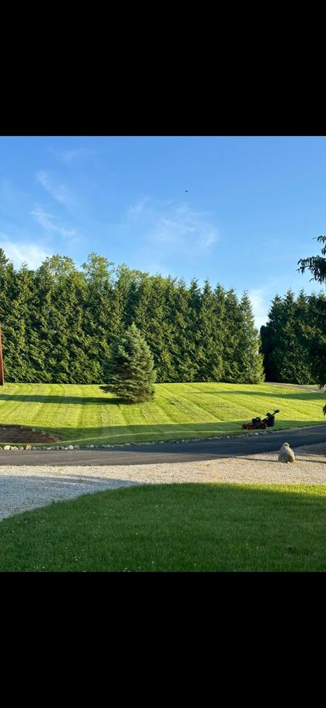 Our Lawn Maintenance service ensures a lush, healthy lawn year-round, offering expert mowing, fertilization, and weed control tailored to your needs for an effortlessly beautiful outdoor space. for Lalo's Landscaping in Goshen, IN