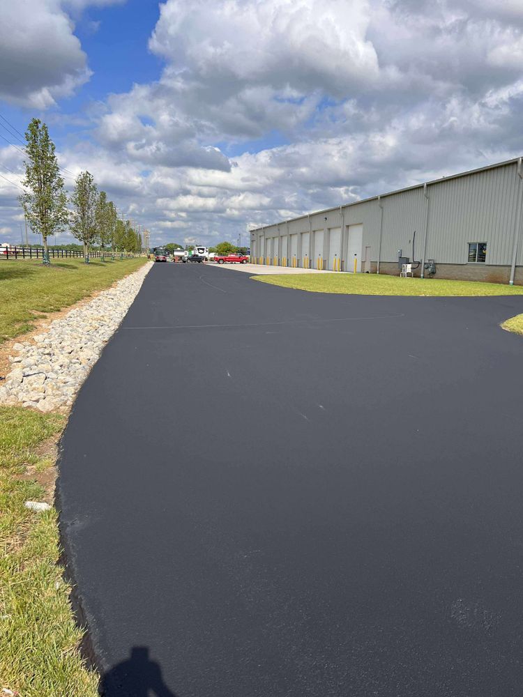 Enhance your property's appeal and accessibility with our expert Parking Lot Construction services, offering durable asphalt paving, efficient planning, and seamless integration tailored to meet your specific residential needs. for Hundley Sealcoating LLC in Hamilton, OH