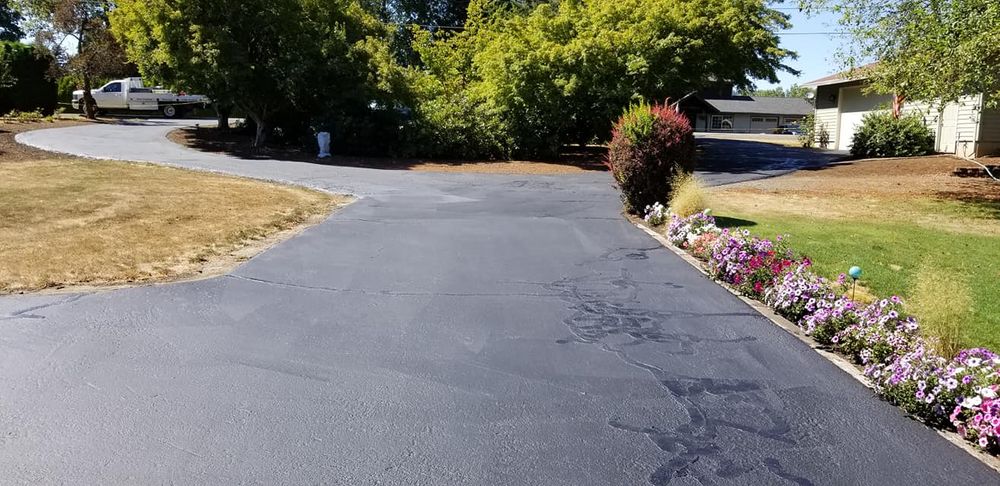Our asphalt paving service delivers smooth, durable driveways and surfaces that enhance curb appeal, improve safety, and withstand daily wear with expert installation, quality materials, and long-lasting results. for Joles Construction in Newberg, OR