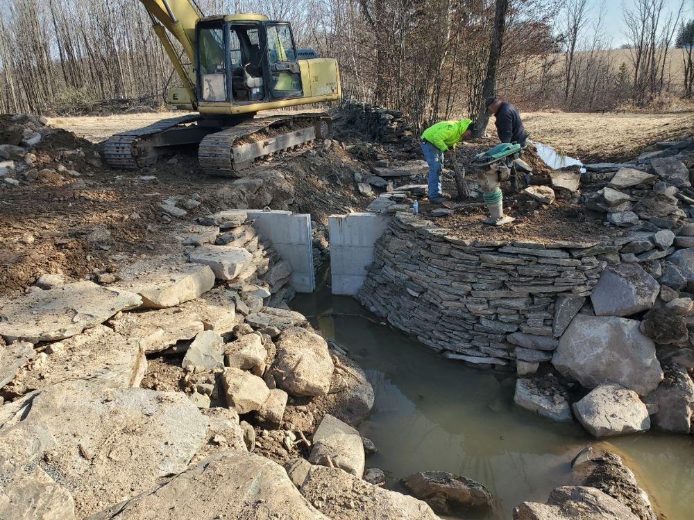 Our Pond Building service transforms your property with expertly excavated, beautiful, functional ponds. Unlike typical road building companies, we focus on drainage, durability, and natural design that enhances your landscape. for R McK Excavating in Lake Ariel, PA
