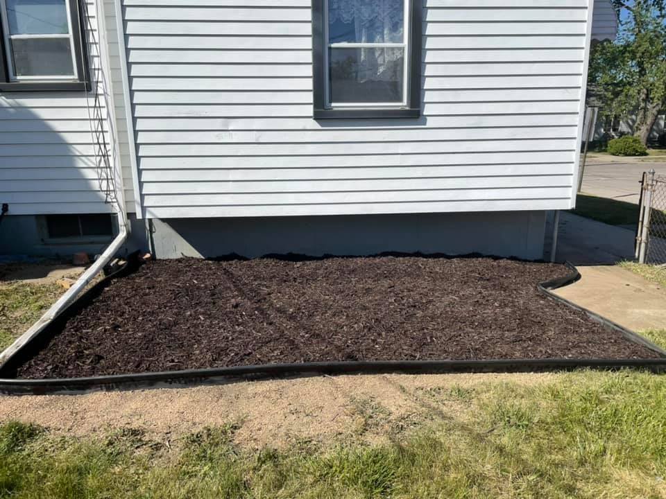 Enhance your garden with our professional mulch installation service, providing superior weed control, moisture retention, and soil improvement. Refresh your landscape effortlessly while promoting healthy plant growth and a polished appearance. for Mow Pros in Westland, MI