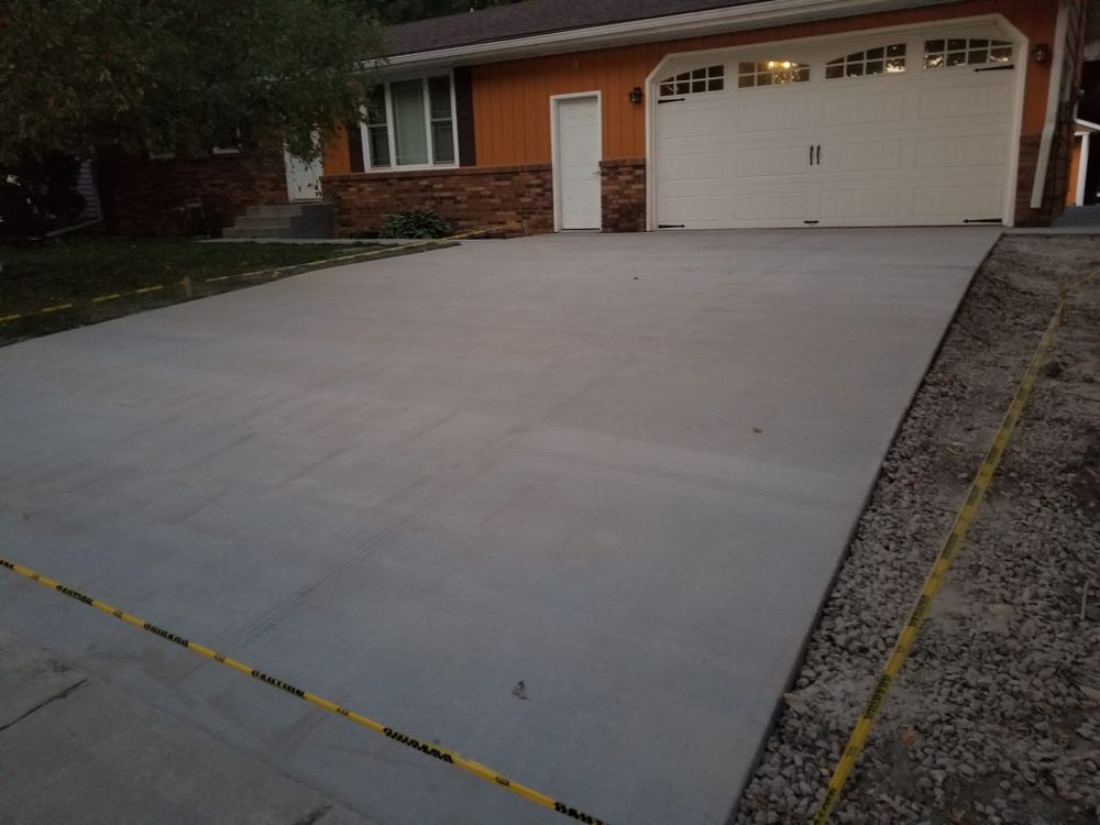 Transform your home's exterior with our professional Concrete Driveways service. We specialize in installation and concrete repair, ensuring a durable, attractive solution that enhances curb appeal and longevity. for Oakdale Masonry in Oakdale, MN