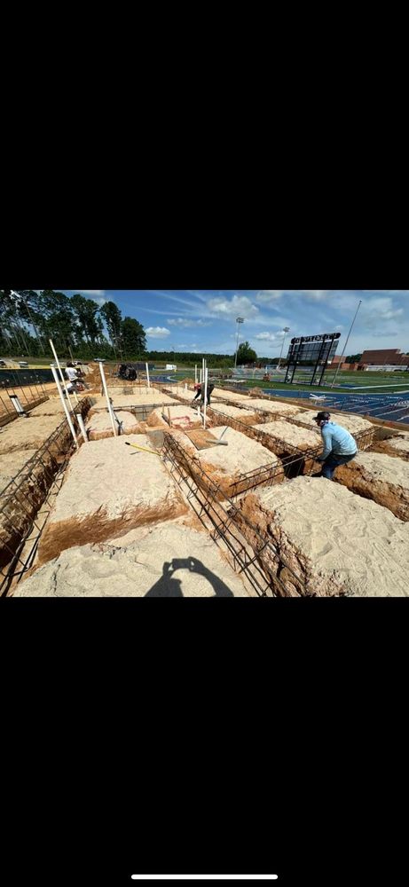 Our Commercial Foundation Pads service provides homeowners with expert excavation and installation of sturdy foundation pads for commercial structures, ensuring durability and stability for long-term construction projects. for Benefield Dirt & Trucking in Monroe, LA