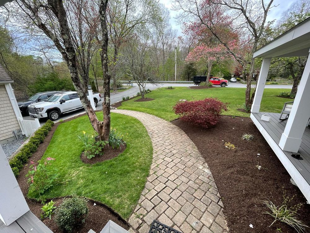 Enhance your garden's beauty and health with our professional mulch installation service. Our team expertly applies high-quality mulch to conserve moisture, control weeds, and nourish plants for a vibrant outdoor space. for Quest Landscapes in North Attleborough, MA