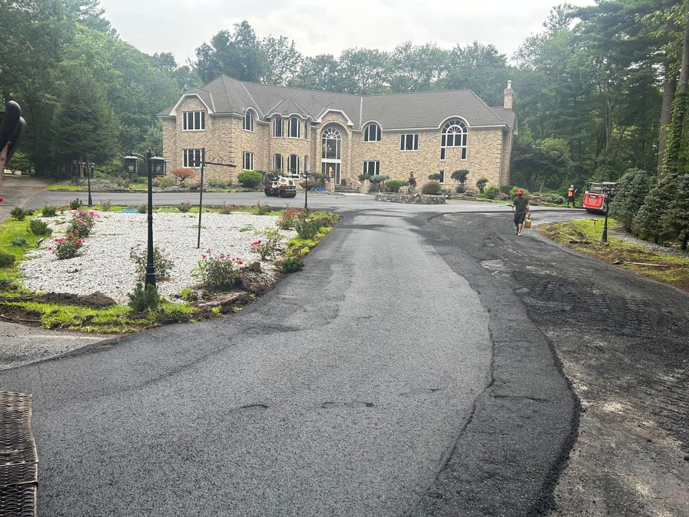 Our expert Asphalt Installation service ensures a durable, smooth surface for your driveway or walkway, using top-quality materials and advanced techniques to enhance curb appeal and withstand harsh weather conditions. for Aldrich & Sons Asphalt Services in Lowell, MA