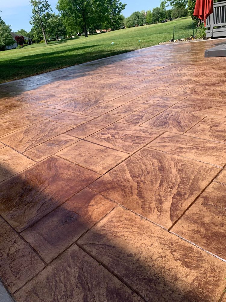 Transform your outdoor space with our stamped concrete installation service. Choose from a variety of patterns and colors to create a unique and durable surface that enhances the beauty of your home. for G&A Contracting, LLC  in Germantown, OH