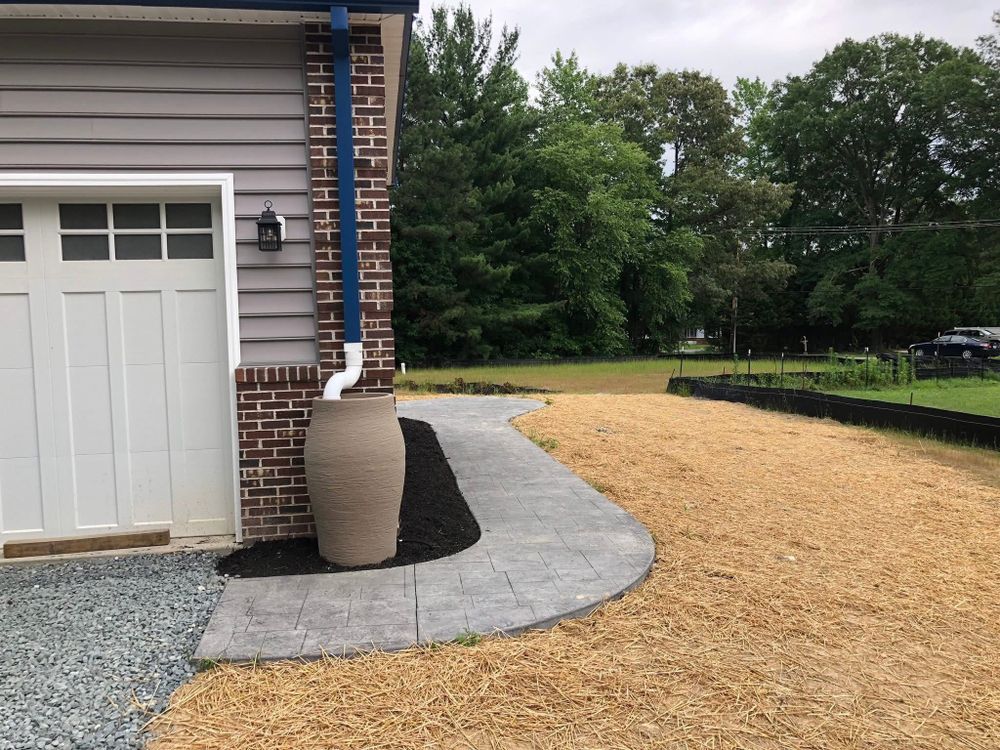 Our Sidewalk Installation service offers homeowners durable, aesthetically pleasing walkways crafted with high-quality concrete. We ensure precise installation tailored to your property's design, enhancing accessibility and curb appeal efficiently and reliably. for Dixie Concrete Masonry LLC in Saint Leonard, MD