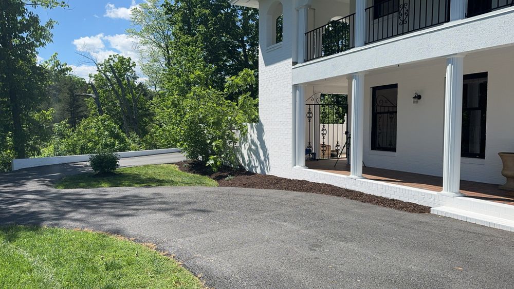 Our Asphalt Maintenance service ensures long-lasting durability and a pristine appearance for your driveway, using expert techniques to repair cracks, reseal surfaces, and protect against weather damage—all enhancing your outdoor living space. for Solid Ground Outdoor Living Solutions in Seaford, DE