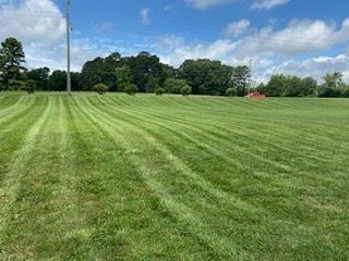 Our comprehensive lawn maintenance service includes mowing, edging, weeding, fertilizing, and pest control to keep your lawn looking lush. Let us help you maintain a beautiful outdoor space effortlessly. for Dream Cuts Landscaping and Lawn Care LLC in Gastonia, NC