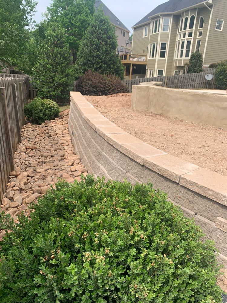 Our Retaining Wall Construction service provides expert design and installation of durable retaining walls to enhance the beauty and functionality of your landscape, ensuring stability for years to come. for Galloway Landscaping in Acworth, GA