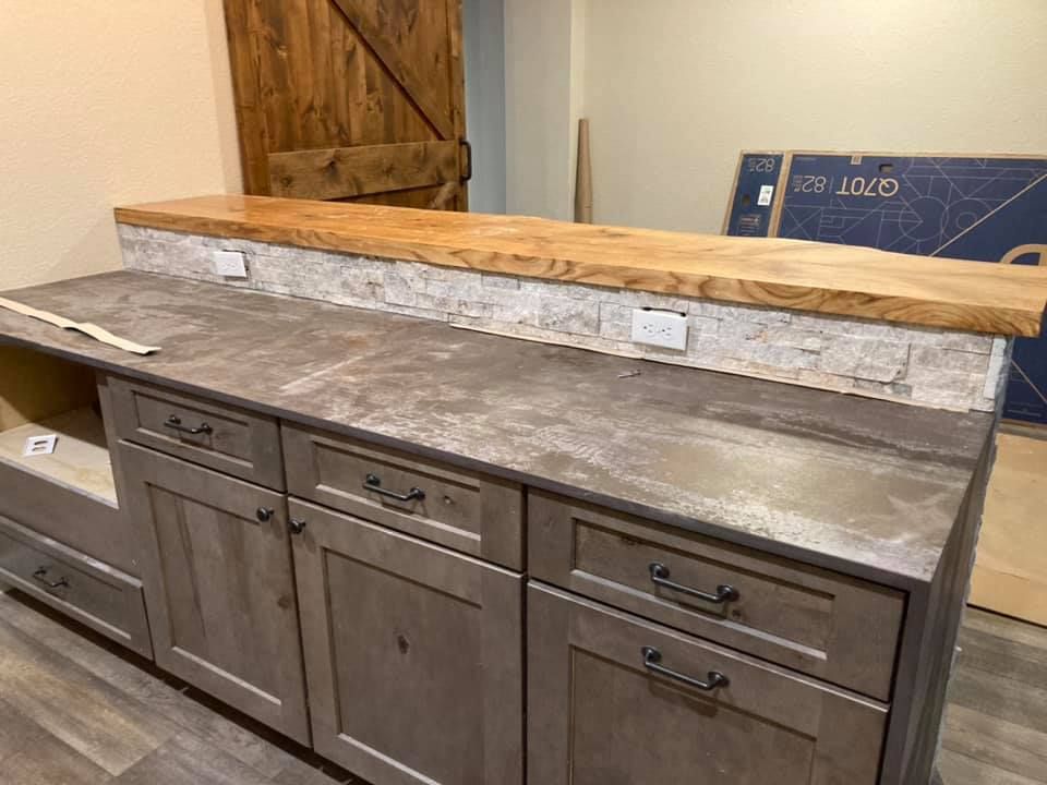 Our Cabinet Refinishing service revitalizes your kitchen or bathroom by giving old cabinets a fresh, modern look with professional painting or staining, enhancing durability and boosting the aesthetic appeal of your space. for Black Gold Construction & Design in Greeley, CO