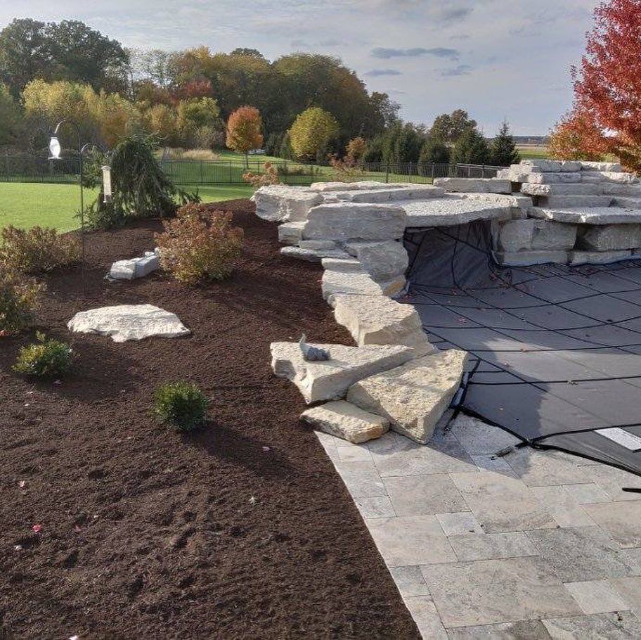 Our Mulch Installation service provides a layer of protective mulch to your landscape beds. Mulch helps retain moisture in the soil, reduces weed growth, and enhances the beauty of your landscape. for Curb Impressions in Toledo,  OH