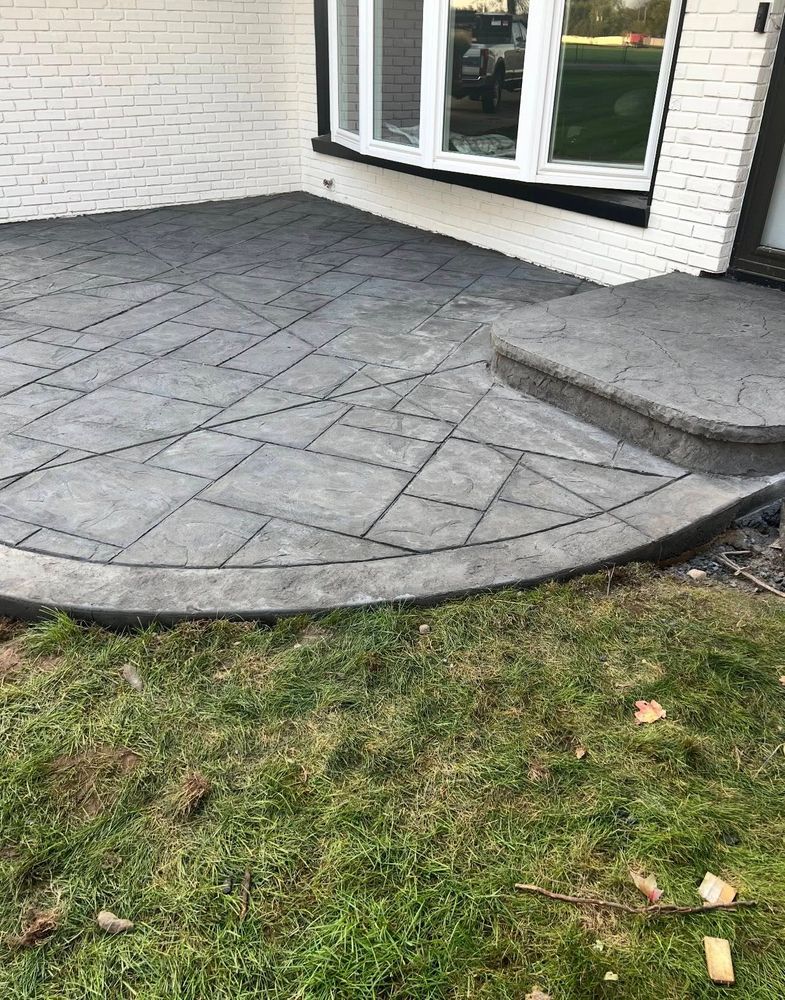 Enhance your home's aesthetics with our expert stamped concrete installation, offering durable, customized designs that mimic natural materials for patios and walkways. Complement your property's exterior beautifully and affordably. for Bermuda Roofing and Remodeling in Elkhart, IN