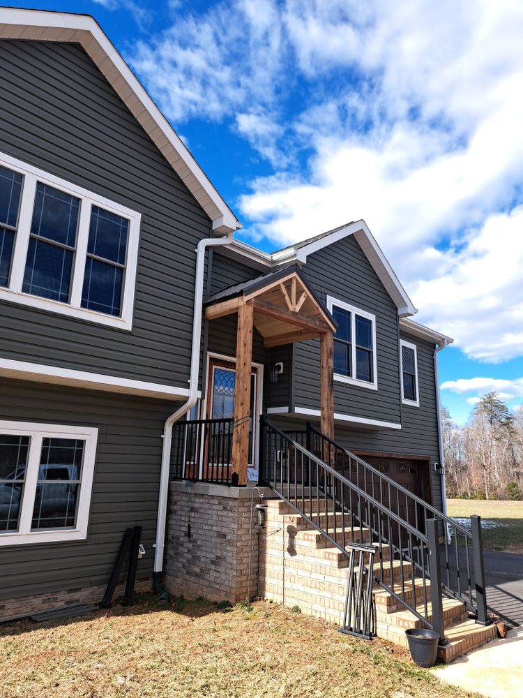 Enhance your outdoor living with our expert deck and porch construction services, offering customized designs, quality craftsmanship, and durable materials to create the perfect space for relaxation or entertainment. for Bostian Construction in Wilkes County, NC