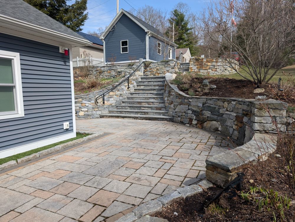 Enhance your property's appeal and functionality with our expert Retaining Wall Construction service, ensuring stability and beauty in your landscape while effectively managing soil erosion and supporting varied elevation levels. for Evolution Earthscapes, LLC in Ludlow, MA