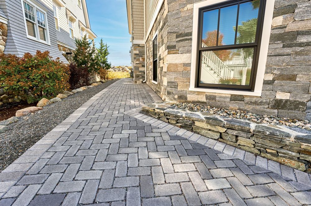 Our professional pavers service transforms outdoor spaces with durable and stylish materials, enhancing your home's curb appeal and value while providing a functional and beautiful surface for walking or driving. for Coastal Exclusive Home Services in Orange Beach, AL