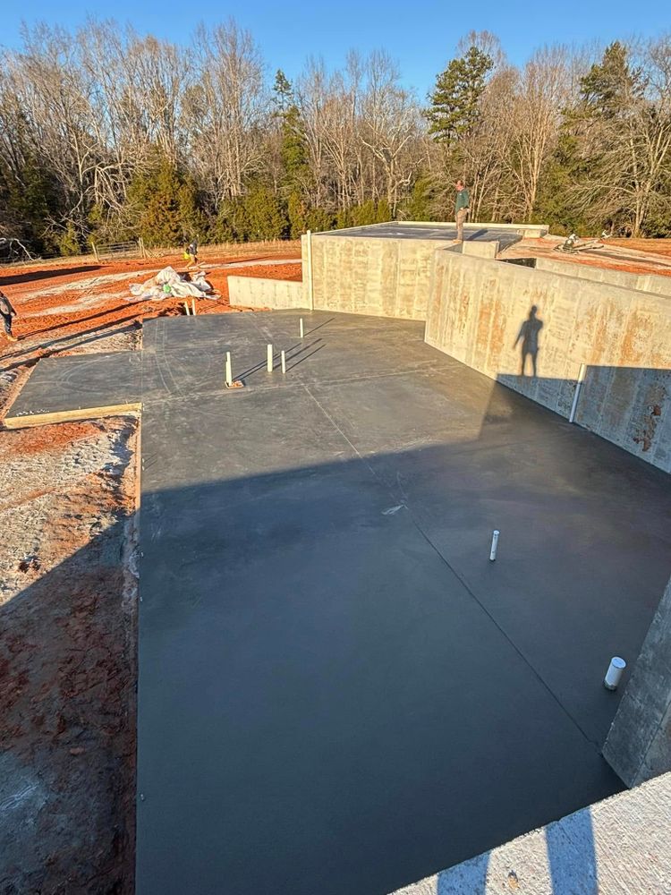 Our expert concrete slab construction service offers durable, level surfaces for various projects, ensuring stability and longevity. We prioritize precision and quality to meet your needs while enhancing your home's foundation. for Baer & Sons Concrete in Greenwood, SC