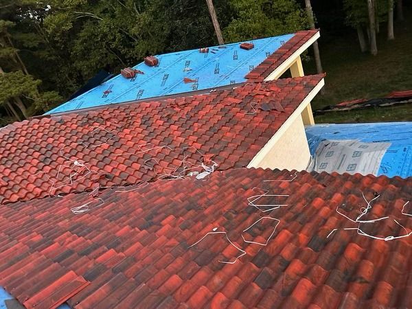Our expert Roofing Repairs service ensures your home's safety and durability, specializing in metal roofing solutions. Trust our professional team to restore and maintain the integrity of your roof efficiently. for Holland Homes in Woodstock, GA