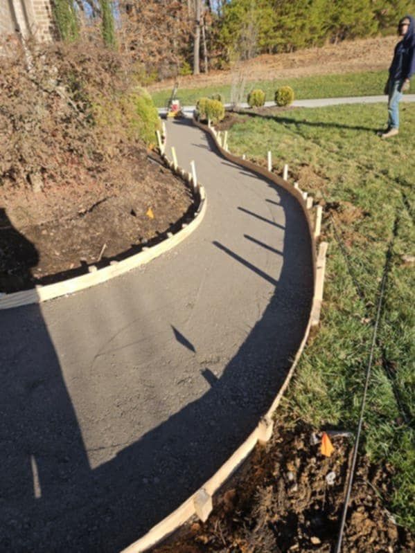 Our concrete service ensures durable and stable deck footers, providing a strong foundation for your outdoor spaces, enhancing safety and structural integrity while blending seamlessly with any landscape design. for S&M DIRT TECH LLC in Knoxville, TN