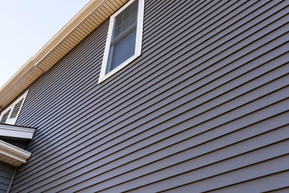 Enhance your home's exterior with our durable vinyl siding services. Our expert team ensures a flawless installation, boosting curb appeal and providing excellent protection against the elements for long-lasting beauty. for LG Roofing Contractors in Summit, IL