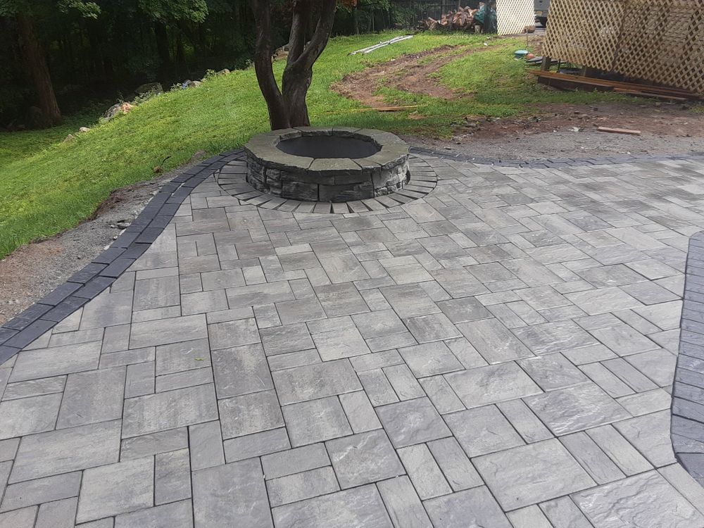 Our Patio Design & Construction service offers homeowners the expertise of our landscaping and hardscaping company to create beautiful outdoor living spaces that enhance their home's aesthetics and functionality. for KB Design LLC in Montague, NJ