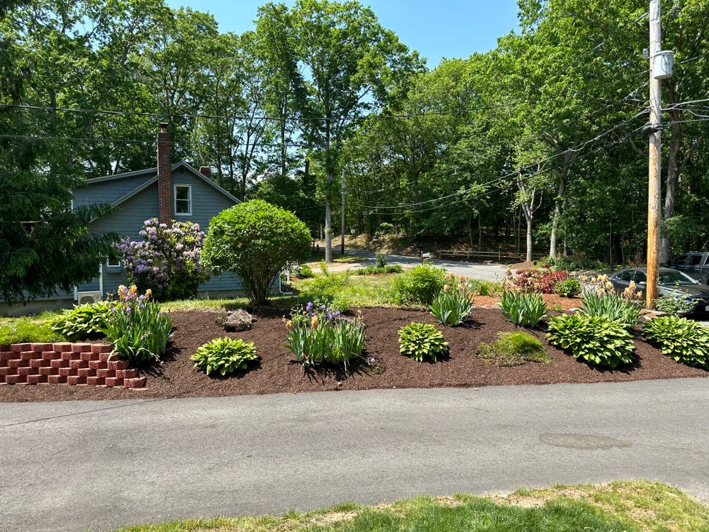 Our Mulch Installation service provides a low-maintenance solution to beautifying your property by helping retain moisture, prevent weed growth, and add nutrients to soil for healthier plants. Schedule your appointment today! for Garduno Landscaping LLC in Cumberland, RI