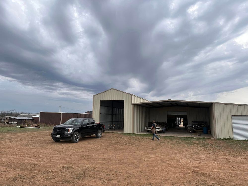 Our custom metal carports protect vehicles, equipment, and outdoor belongings from sun, rain, and hail with durable construction, flexible sizing, expert installation, and affordable solutions tailored to your property. for Iron Cross Construction in Abilene, TX