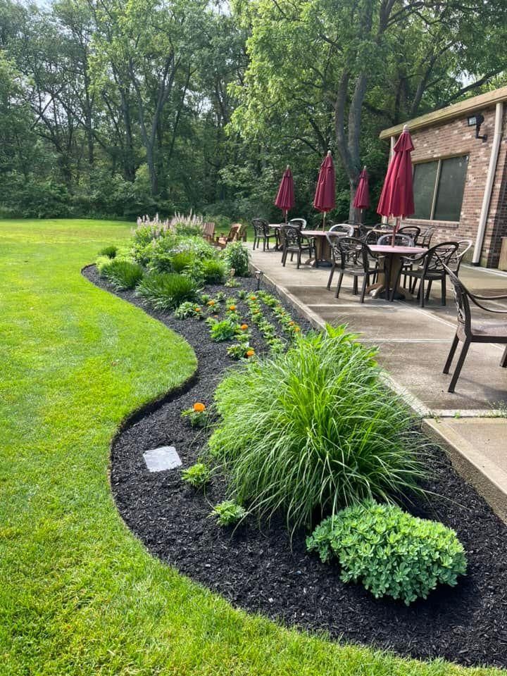 Transform your outdoor space with our Mulch Installation service. Our skilled team will carefully install a fresh layer of mulch in your garden beds, suppressing weeds and retaining moisture for healthier plants. for Higgins landscaping LLC in West Jefferson, OH