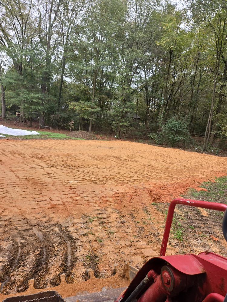 Our Grading service ensures a stable, level foundation for your projects, enhancing safety and longevity by expertly preparing the land with precision before any concrete work begins. for Good Hope Concrete in Monroe, GA