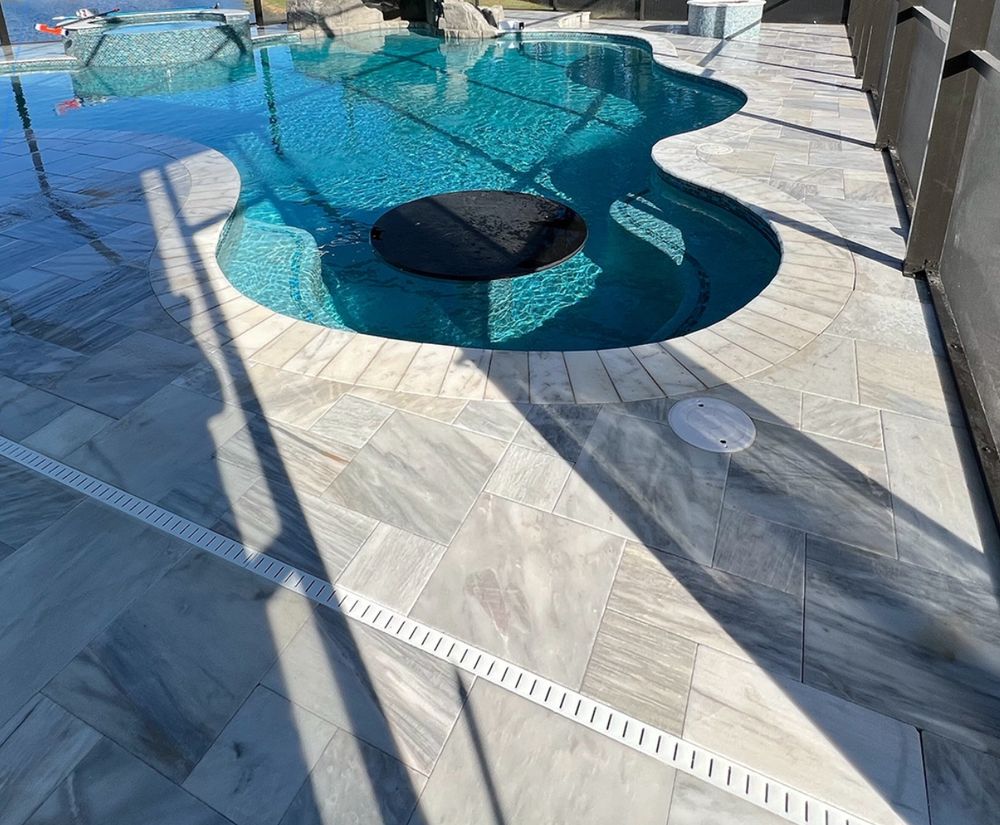 Transform your pool area with our expert Pool Deck Paving service, offering durable materials and stylish designs to enhance safety, aesthetics, and functionality while increasing your home's value. for Ziquita Pavers Inc.  in Cape Coral, FL