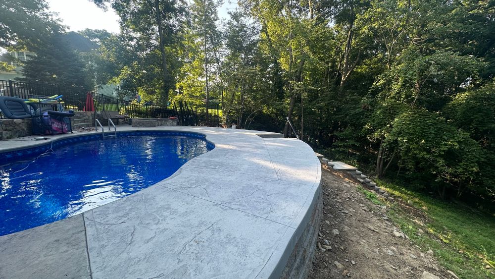 Our Stamped Concrete Installation offers premium step installation services, creating beautiful and durable surfaces that enhance your home's aesthetic appeal while ensuring functionality and longevity for outdoor spaces. for Greenscaping & Masonry LLC in Bethel, CT