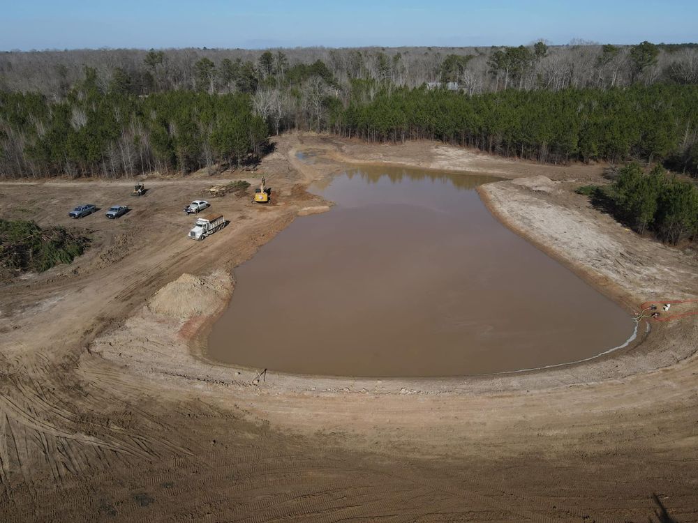 Transform your outdoor space with our pond building service, expertly designed to enhance aesthetic appeal and ecological balance. Let our experienced team create a serene water feature tailored to your vision. for DC Construction Company LLC in Clanton, AL