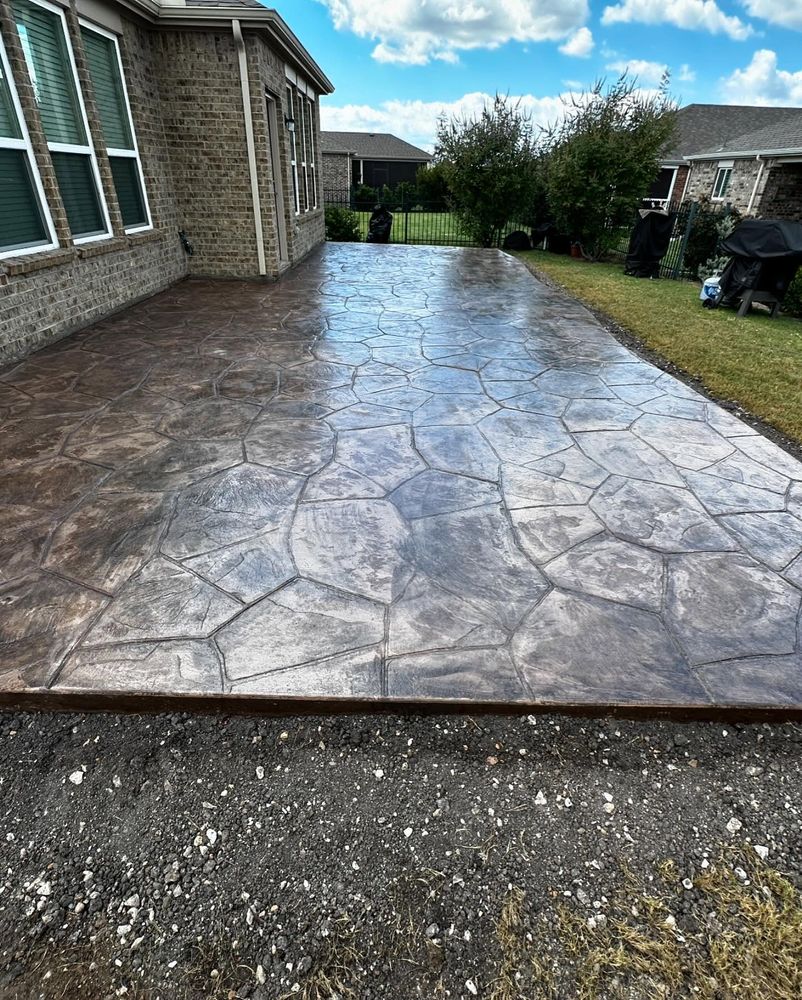 Transform your home's outdoor spaces with our Decorative Concrete Services, specializing in stamped concrete installation for unique, stylish patios and walkways that enhance curb appeal and durability. for EMG Construction in Balch Springs, TX