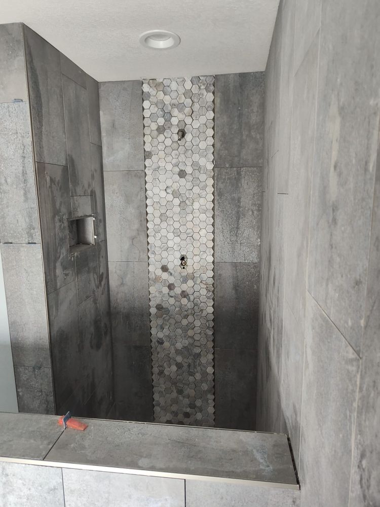 Transform your bathroom with our expert tiling services. Our skilled team ensures precise installation and high-quality materials for a stylish and durable finish that enhances functionality and aesthetic appeal. for Brennan Custom Tiling, flooring and more in Gainesville, FL