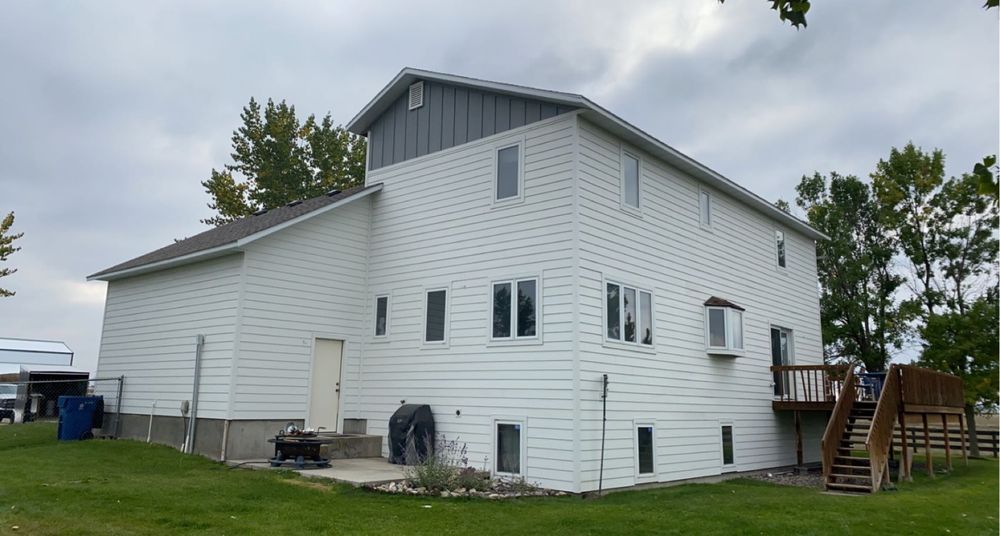 Enhance your home's curb appeal and energy efficiency with our expert vinyl siding house services. Our team offers professional installation and durable materials, ensuring a beautiful, low-maintenance exterior for years to come. for GLOC Construction in Billings, MT