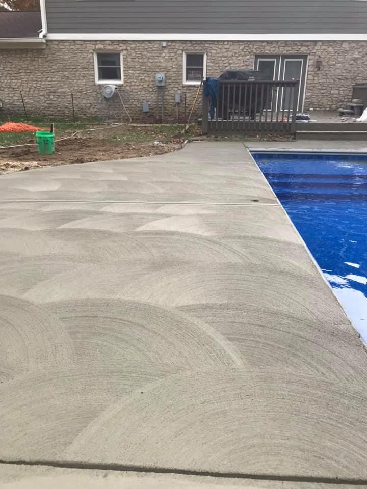 Enhance your home's outdoor living space with our Pool Deck Paving service. Our expert team will transform your pool area with durable and stylish concrete paving solutions, ensuring a beautiful finish. for Blevins Concrete in Greencastle, IN