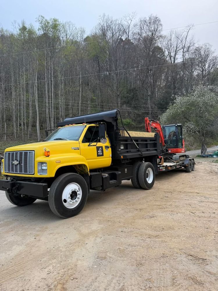 Our Hauling service efficiently removes debris, soil, or construction materials from your property, ensuring a clean and safe environment. Trust us to handle heavy loads with care and professionalism. for PCC Land Works in Marshall, NC