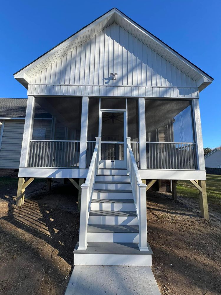 Transform your outdoor space with our beautiful screened in porches and decks, offering durable materials such as Trex decking, customized designs, and professional craftsmanship to enhance beauty and functionality in your home's exterior oasis. for Johnson Carpentry & Remodeling LLC in Four Oaks,  NC